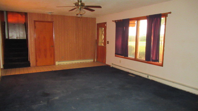 2202 Cr E 2400 Rd Street North St. Joseph, IL 61873 - Photo 5 of 11 an empty room with windows and cabinet