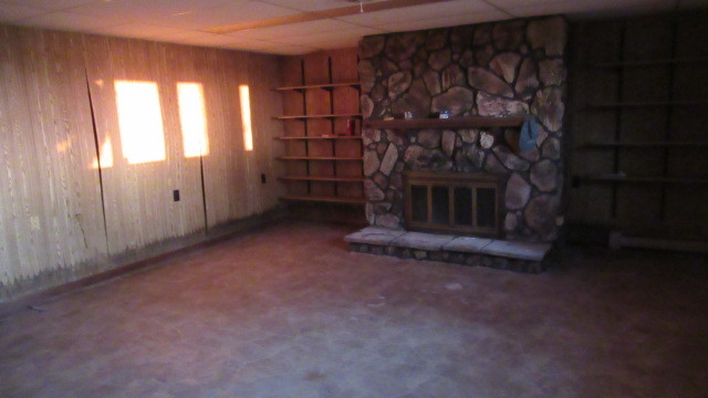 2202 Cr E 2400 Rd Street North St. Joseph, IL 61873 - Photo 9 of 11 a view of an empty room with a fireplace and a window
