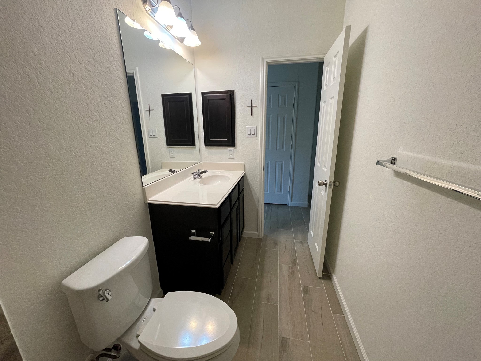 4118 Guild Meadows Drive Houston, TX 77084 - Photo 14 of 35 a bathroom with a toilet a sink and mirror