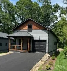 a house with trees in the background