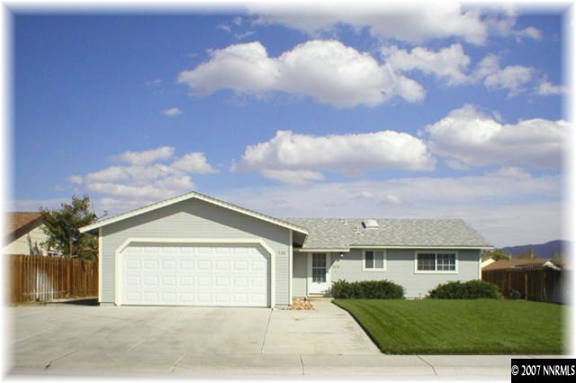 528 Yellow Jacket Road Dayton, NV 89403 - Photo 1 of 9 a front view of a house with a yard