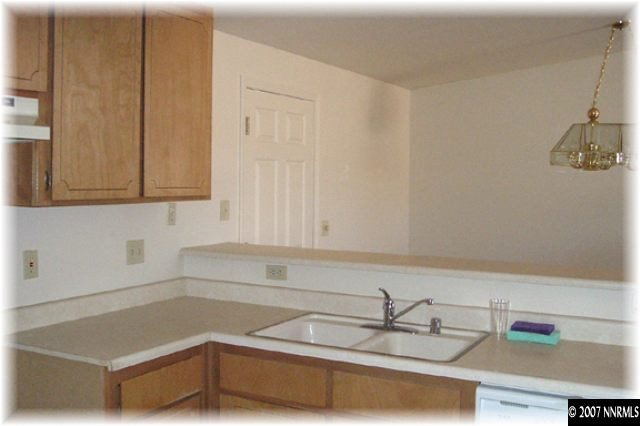 528 Yellow Jacket Road Dayton, NV 89403 - Photo 2 of 9 a kitchen with a sink and cabinets