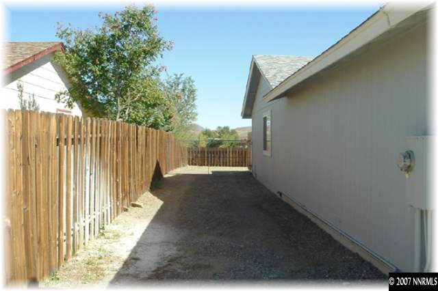 528 Yellow Jacket Road Dayton, NV 89403 - Photo 9 of 9 a view of a pathway of a house with wooden floor