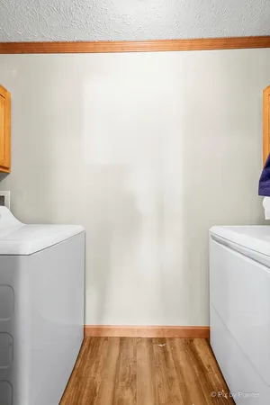 a bedroom with a bed and a flat tv screen on the dresser