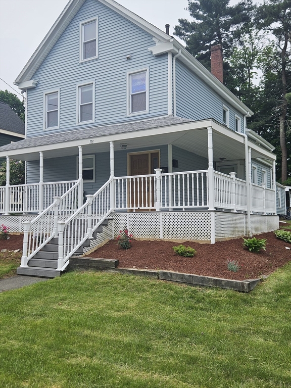 113 Rockland Street, Unit 2 Canton, MA 02021 - Photo 2 of 22 a front view of a house with a yard
