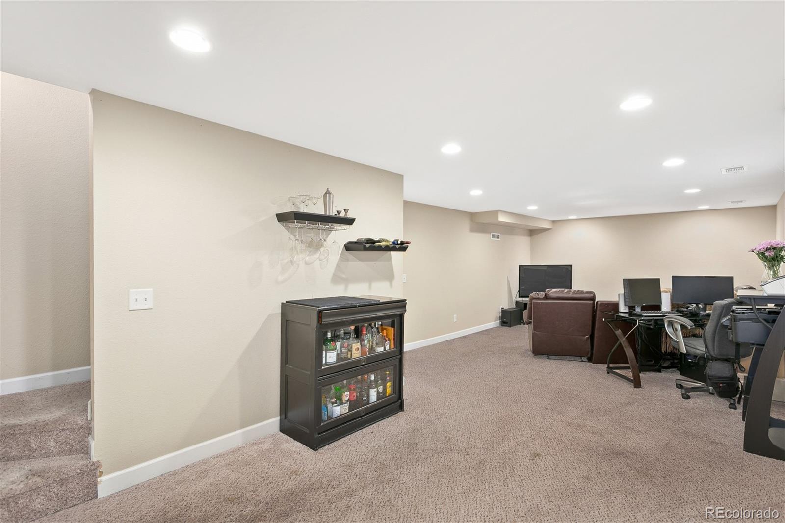 4139 East 131st Drive Thornton, CO 80241 - Photo 15 of 29 a living room with furniture and a table