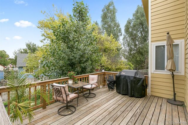 a view of balcony with furniture