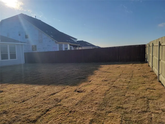 a view of a kitchen with pool table and chairs
