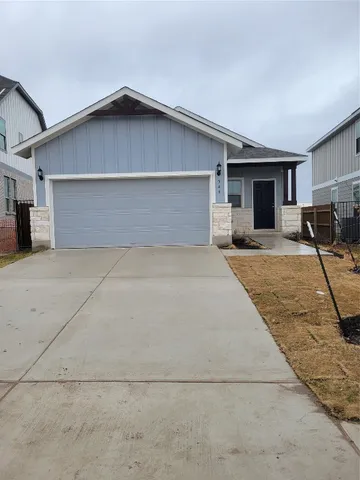 a house with yard in front of it