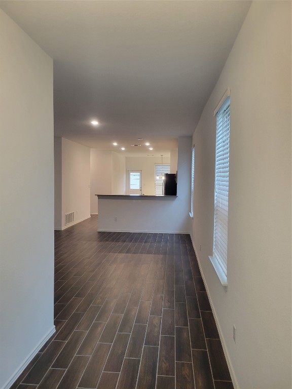 549 Pickrell Loop Georgetown, TX 78628 - Photo 3 of 26 a view of a room with wooden floor and a window