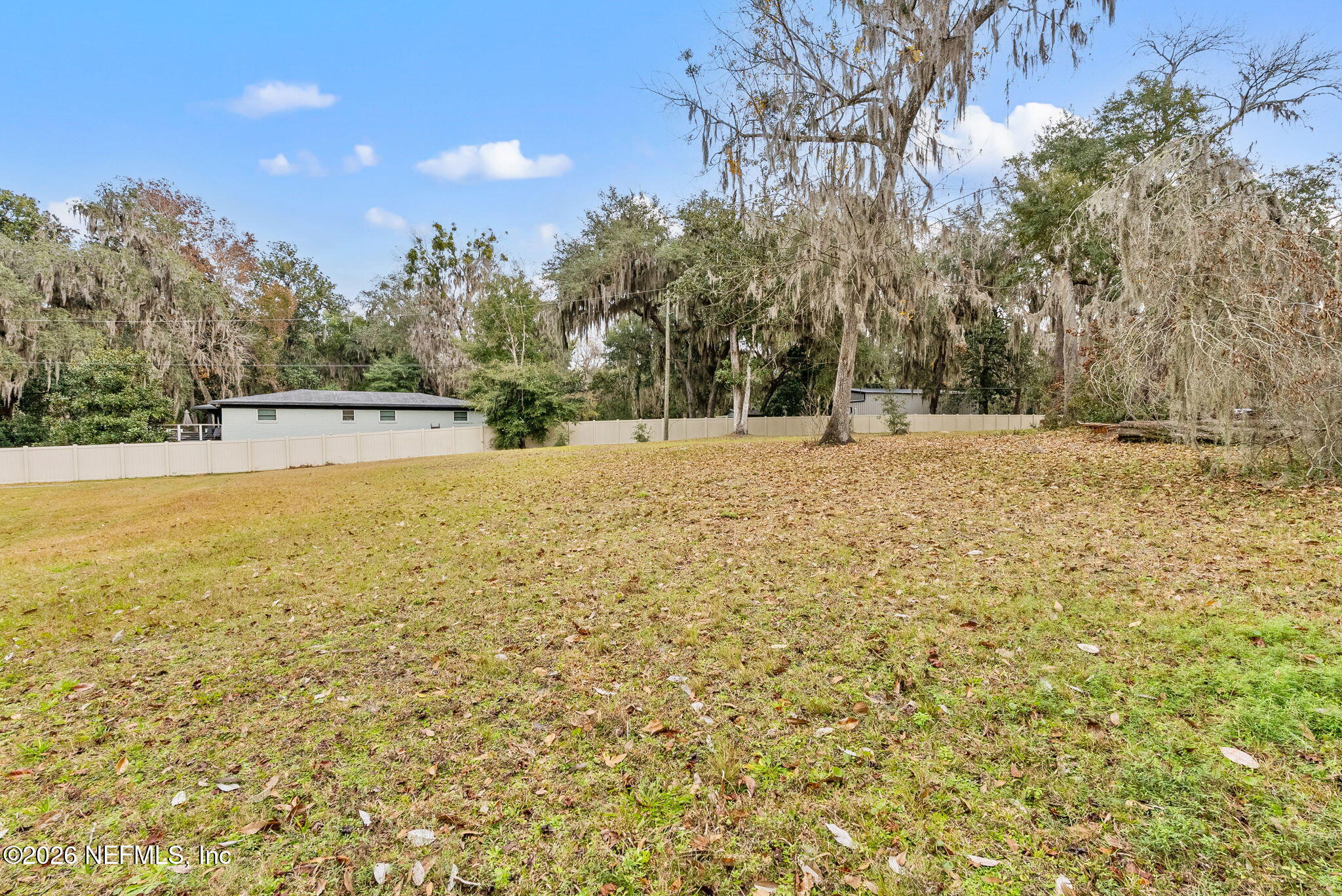 0 Eventide Avenue St. Johns, FL 32259 - Photo 13 of 15 a view of large trees with wooden fence