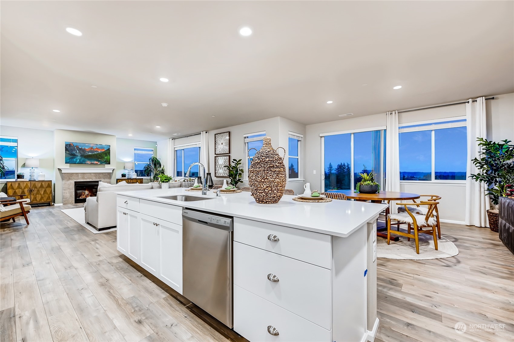 4393 Reef Road Southwest, Unit 3047 Port Orchard, WA 98367 - Photo 13 of 27 a kitchen with white cabinets and sink