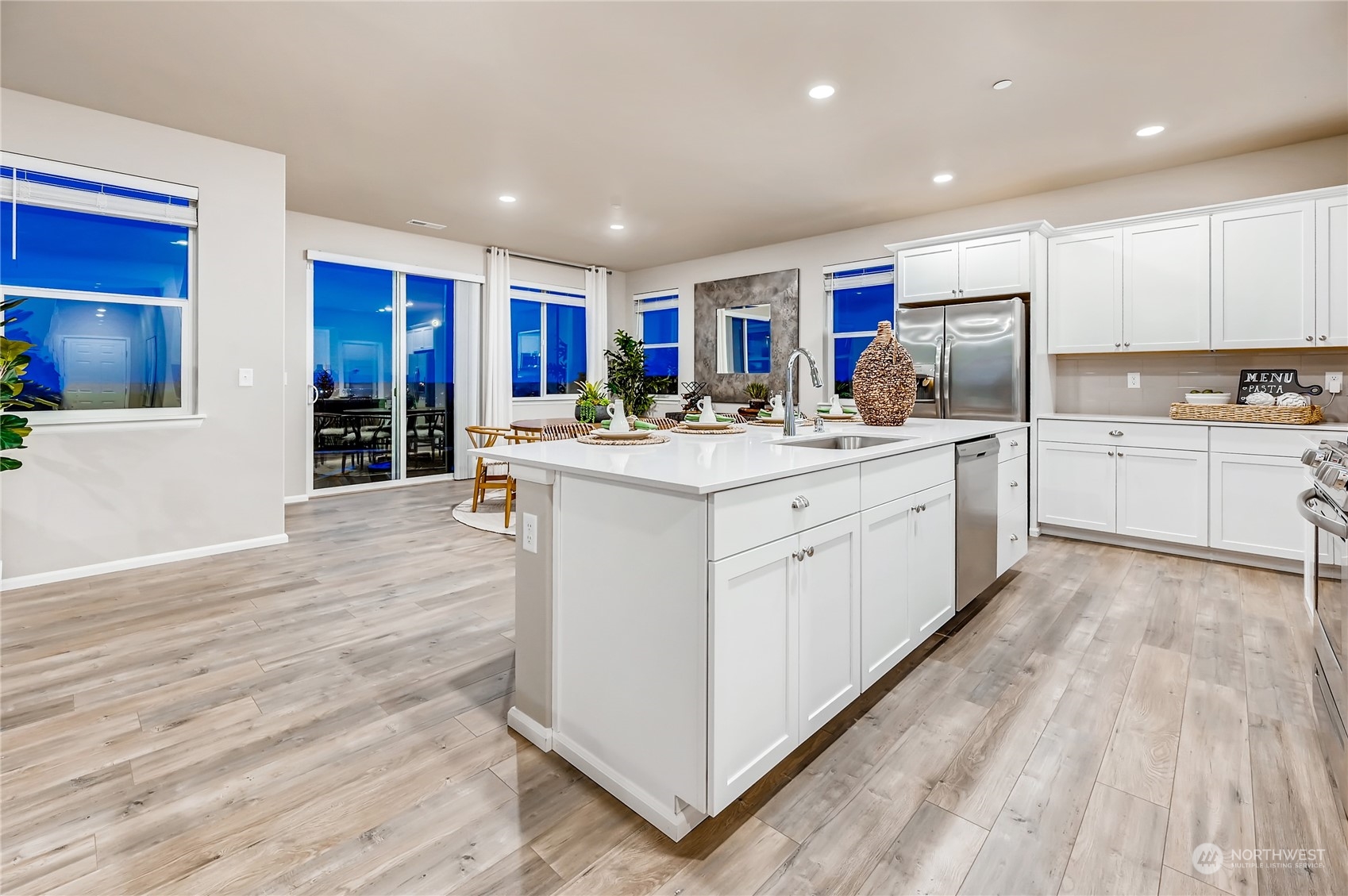 4393 Reef Road Southwest, Unit 3047 Port Orchard, WA 98367 - Photo 15 of 27 a kitchen with a sink cabinets and wooden floor