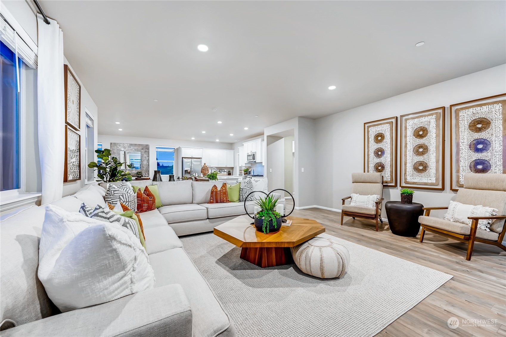 4393 Reef Road Southwest, Unit 3047 Port Orchard, WA 98367 - Photo 19 of 27 a living room with furniture potted plant and wall painting