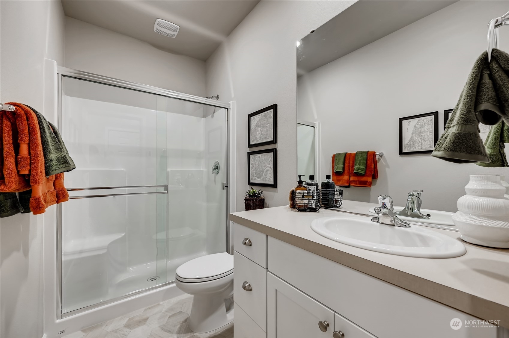 4393 Reef Road Southwest, Unit 3047 Port Orchard, WA 98367 - Photo 2 of 27 a bathroom with a sink toilet and shower