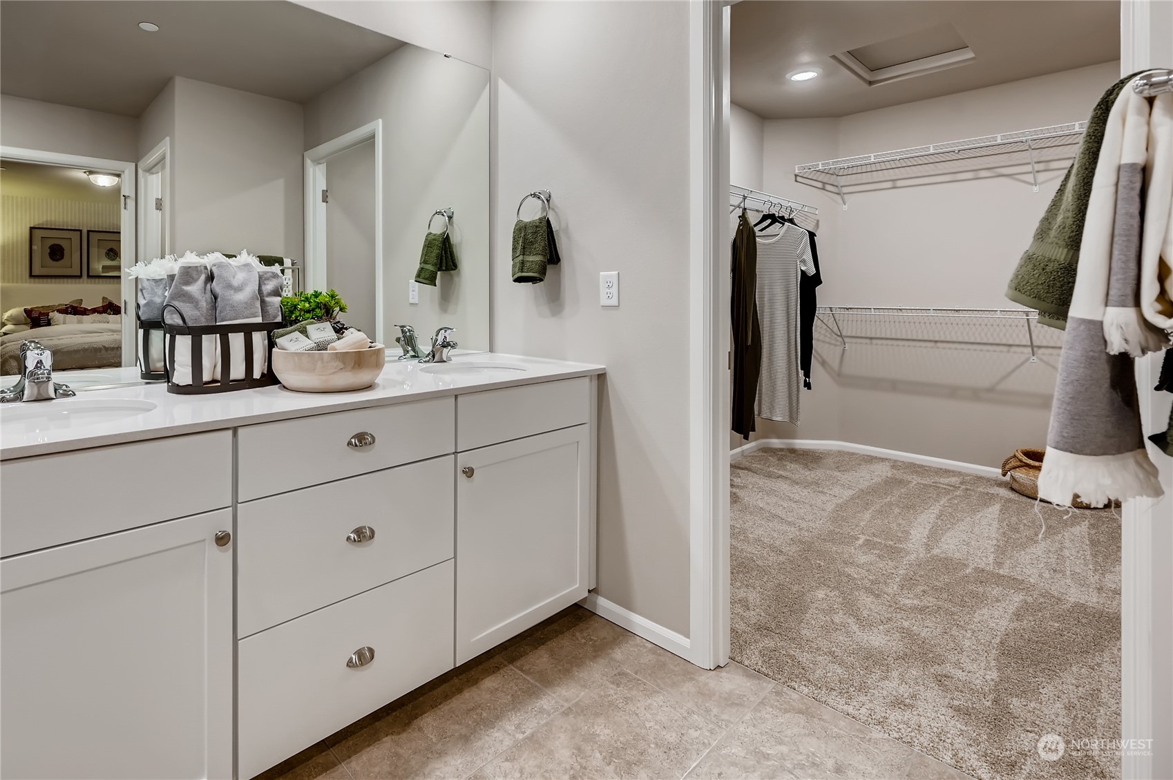 4393 Reef Road Southwest, Unit 3047 Port Orchard, WA 98367 - Photo 22 of 27 a bathroom with a double vanity sink and mirror