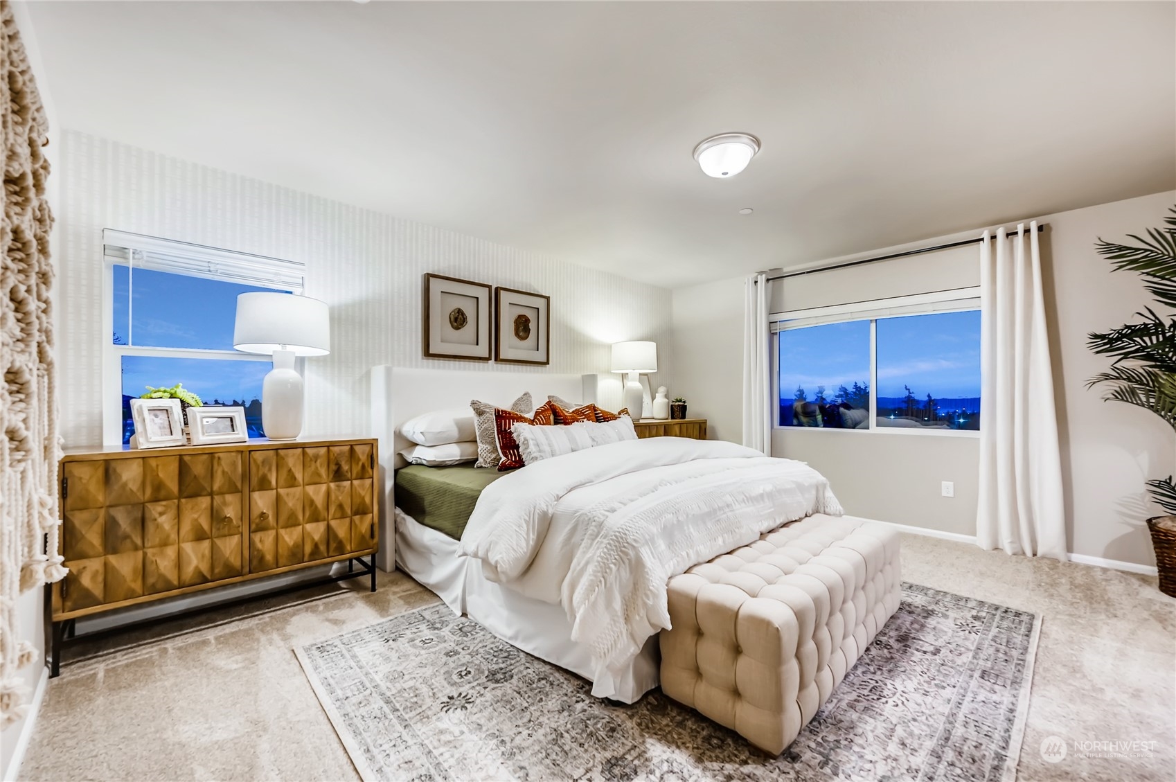 4393 Reef Road Southwest, Unit 3047 Port Orchard, WA 98367 - Photo 24 of 27 a bedroom with a large bed and a couch