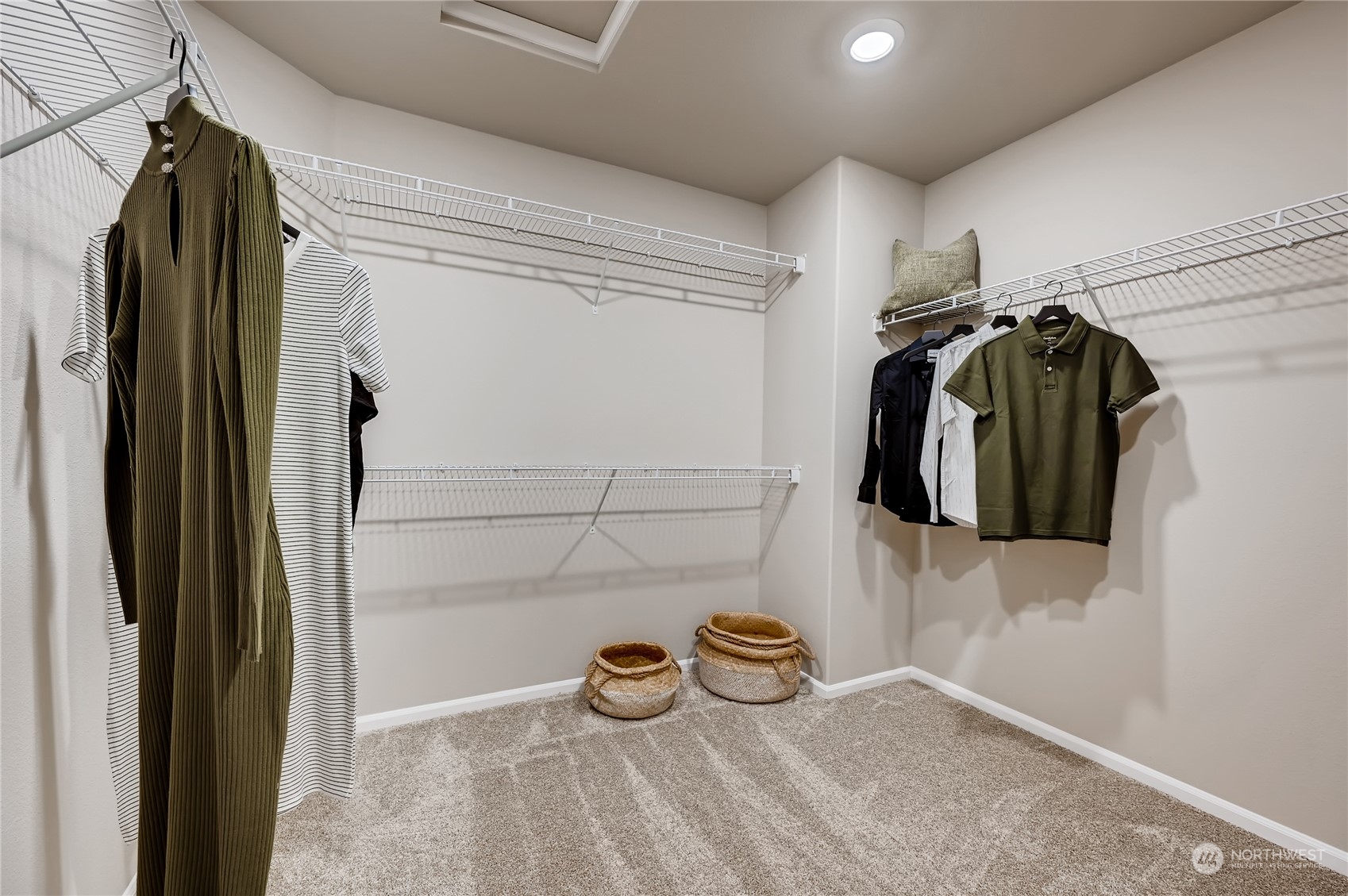 4393 Reef Road Southwest, Unit 3047 Port Orchard, WA 98367 - Photo 26 of 27 a view of walk in closet with clothes and shoes