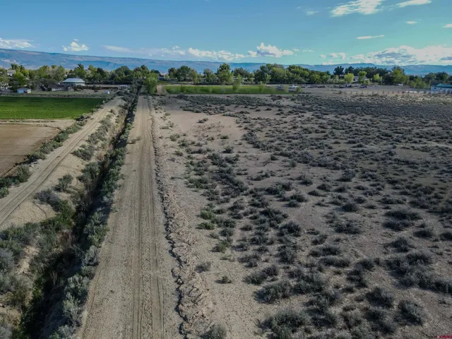 a view of a lake with a yard