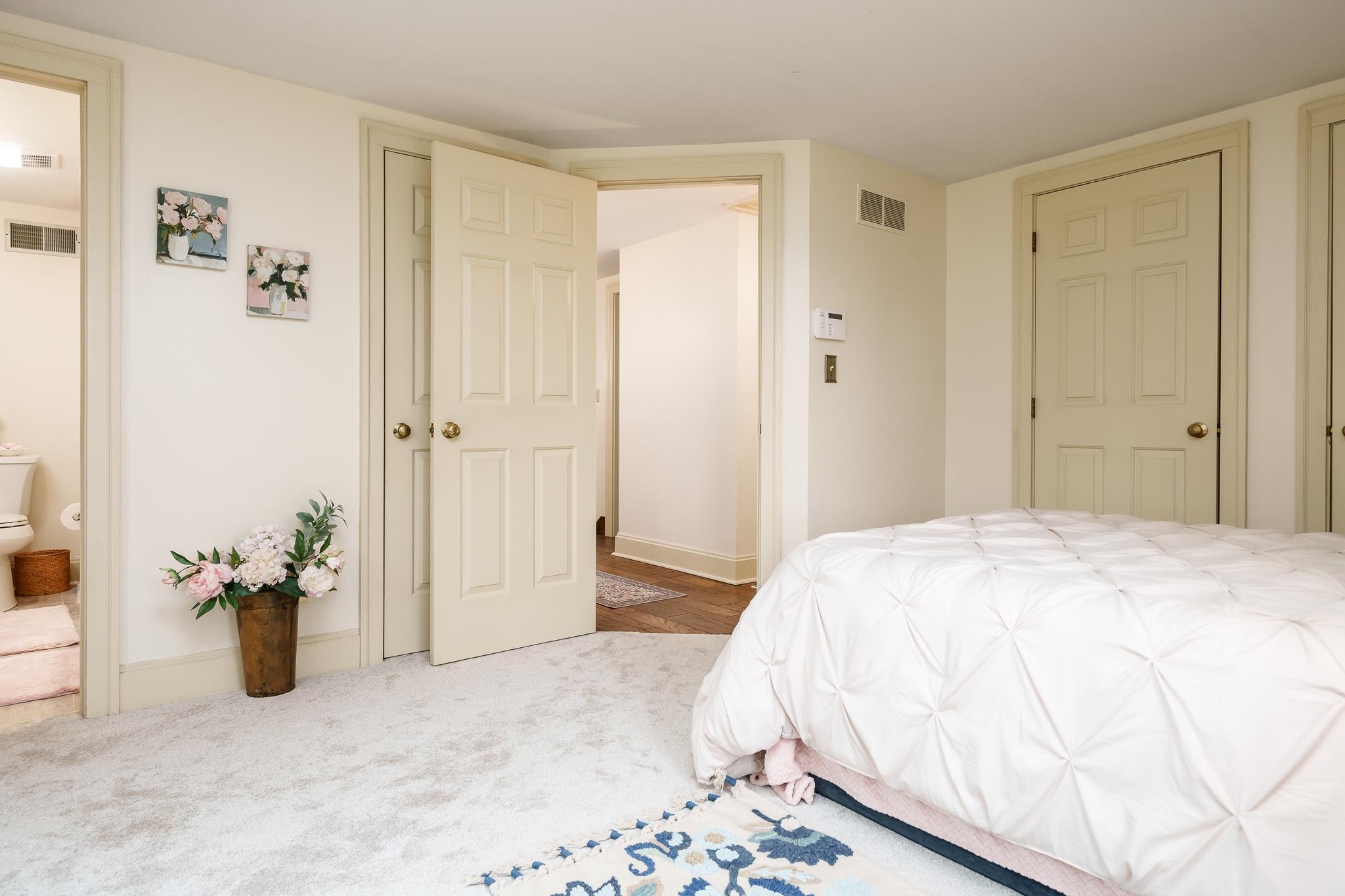 10562 Town Hall Road Belvidere, IL 61008 - Photo 49 of 72 a bedroom with a bed and a potted plant