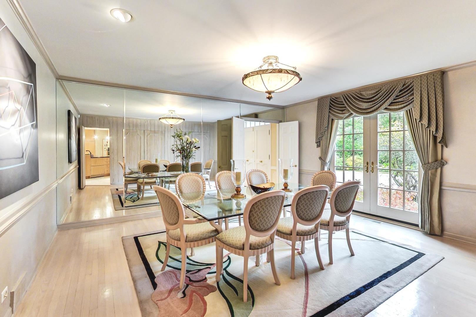 24 Longmeadow Road Winnetka, IL 60093 - Photo 8 of 38 a view of a dining room with furniture window and wooden floor