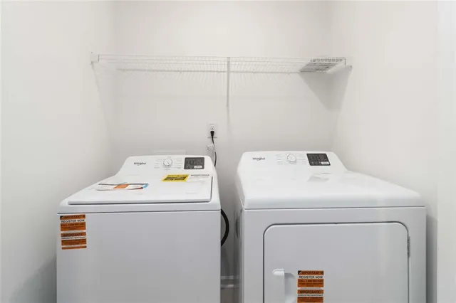 a utility room with dryer and washer