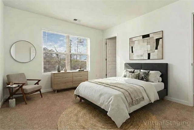 a bedroom with a bed and a couch