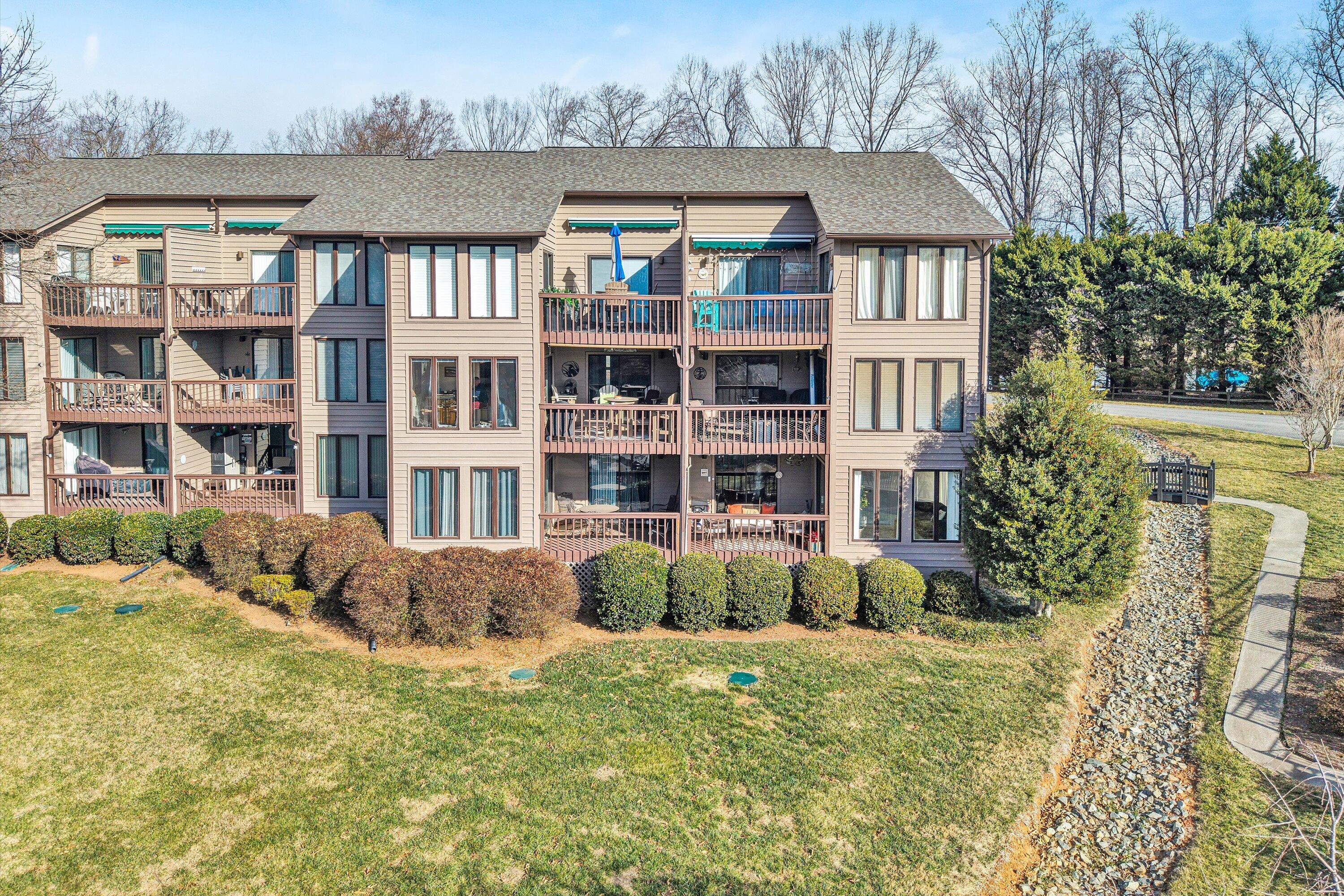 630 Monte Vista Road, Unit 506 Union Hall, VA 24176 - Photo 26 of 50 a front view of a residential apartment building with a yard