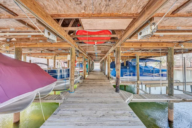 a swimming pool with outdoor seating and yard