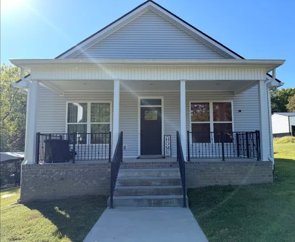 a front view of a house having yard