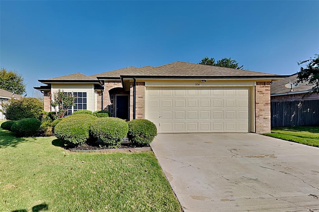 314 South Chestnut Street Forney, TX 75126 - Photo 1 of 18 Single story home featuring brick siding, concrete driveway, roof with shingles, and an attached garage