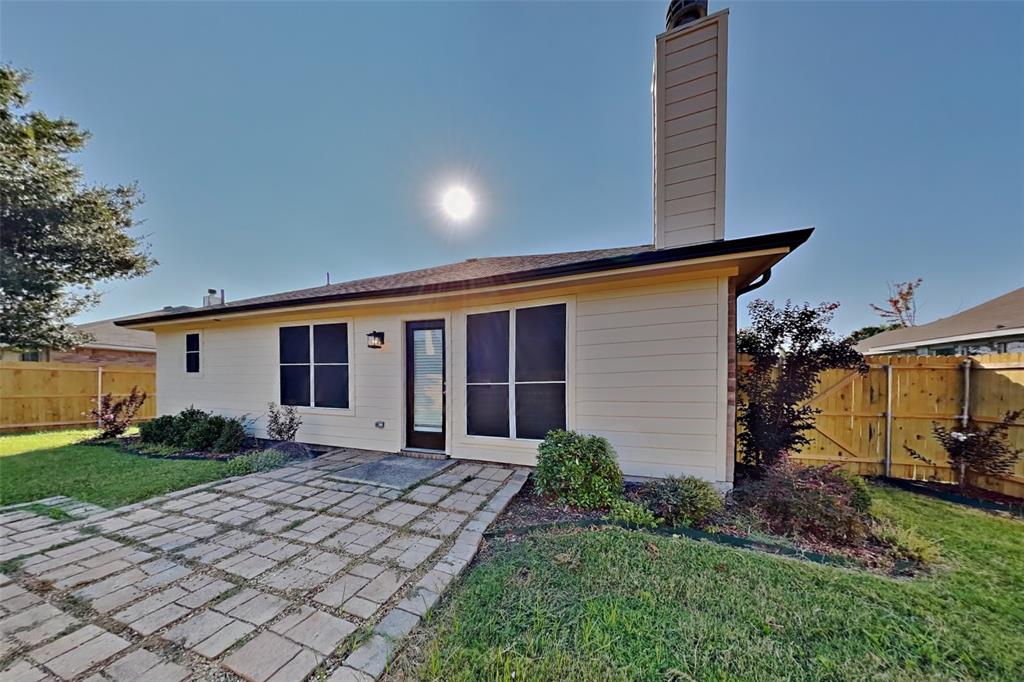 314 South Chestnut Street Forney, TX 75126 - Photo 16 of 18 Back of property featuring a chimney and a patio area