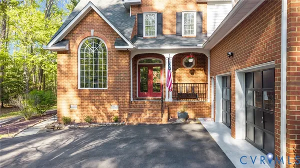 a view of entryway with wooden floor and window