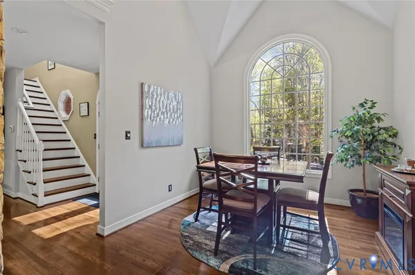 a living room with furniture fireplace and flat screen tv