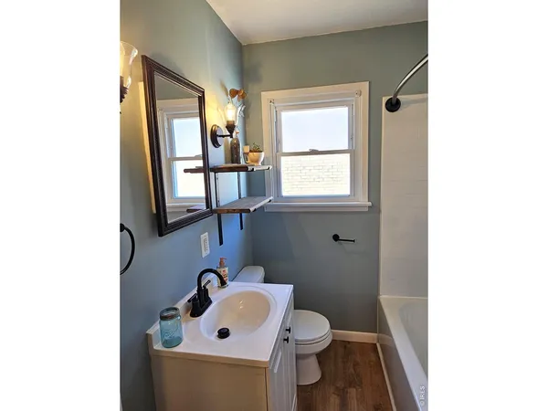 a bathroom with a toilet and a sink