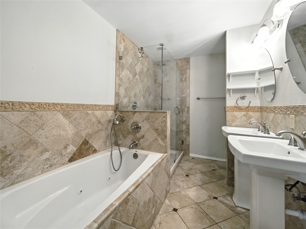 1604 Springdale Road Austin, TX 78721 - Photo 12 of 29 a bathroom with a sink and a bathtub