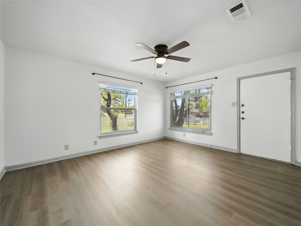 1604 Springdale Road Austin, TX 78721 - Photo 15 of 29 a view of room with hardwood floor and window