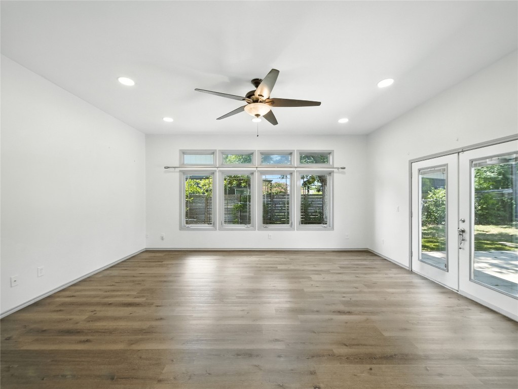1604 Springdale Road Austin, TX 78721 - Photo 17 of 29 a view of empty room with wooden floor and fan