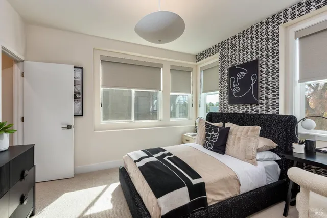 a bedroom with a bed and window