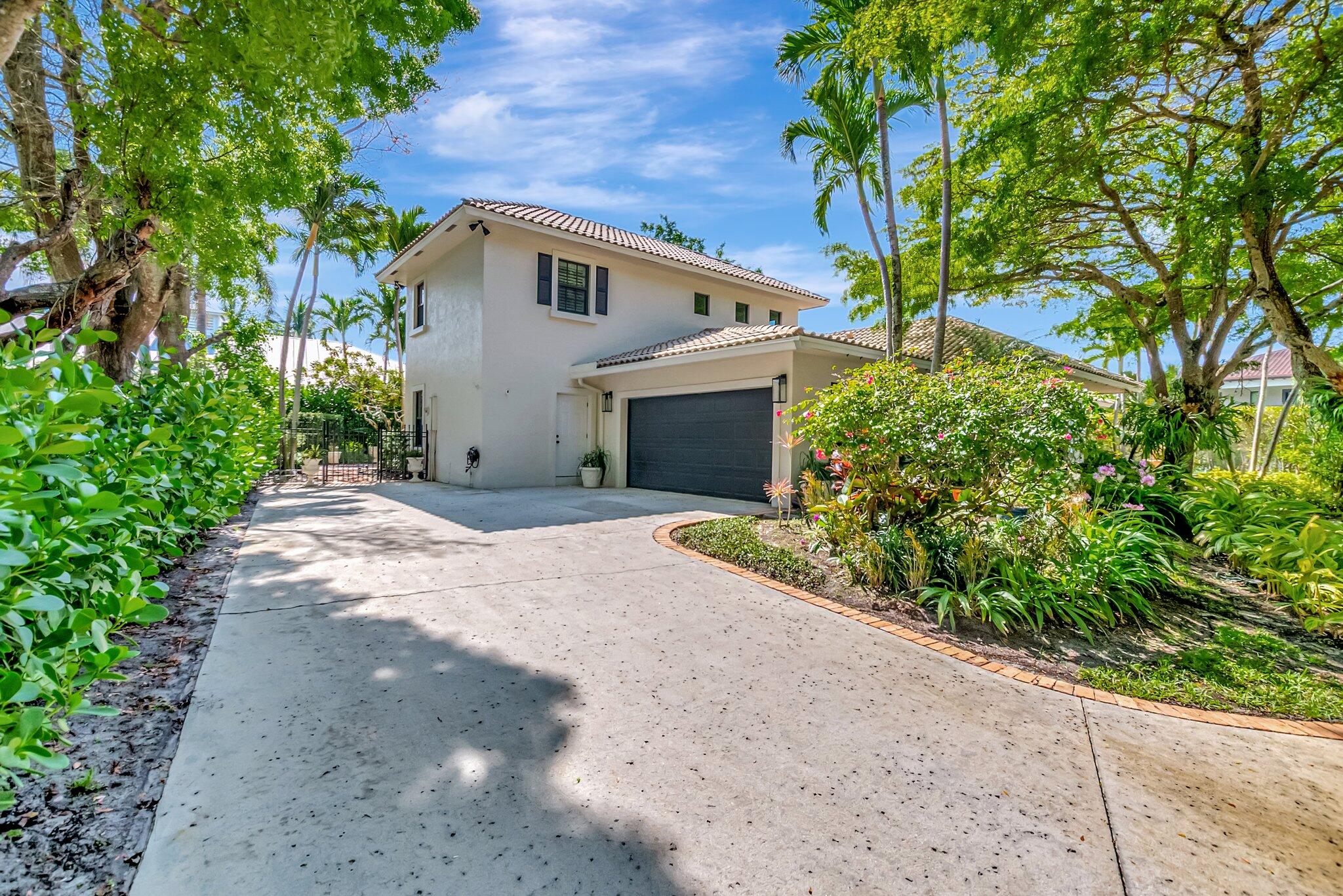 284 Florenada Terrace Boca Raton, FL 33486 - Photo 28 of 29 Driveway-Side Garage Entry