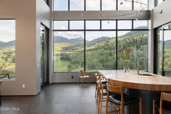 a dining room with furniture and window