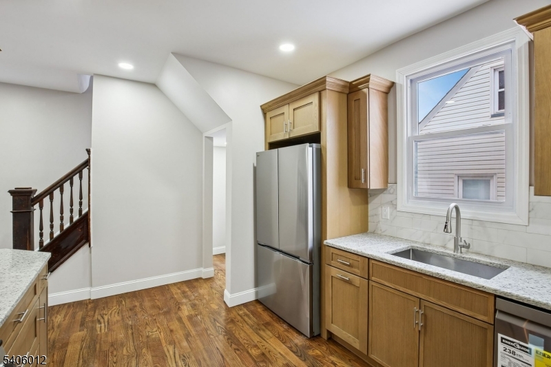 99 Lincoln Street Montclair, NJ 07042 - Photo 15 of 28 a kitchen with stainless steel appliances granite countertop a refrigerator and a sink
