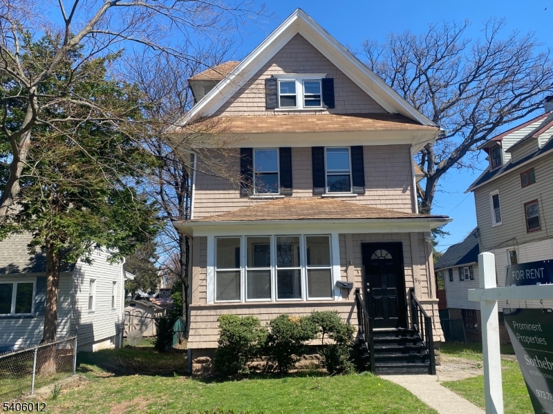 99 Lincoln Street Montclair, NJ 07042 - Photo 2 of 28 a front view of a house with a yard