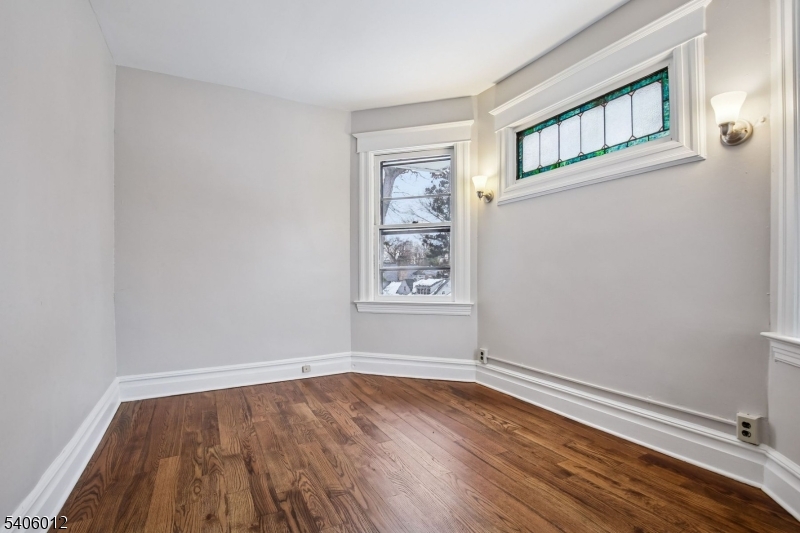99 Lincoln Street Montclair, NJ 07042 - Photo 21 of 28 a view of an empty room with wooden floor and a window
