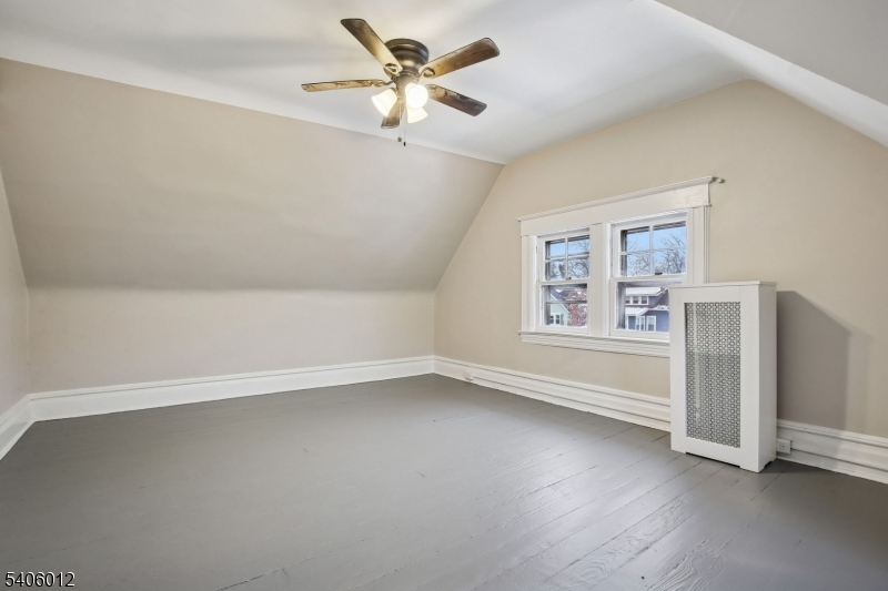 99 Lincoln Street Montclair, NJ 07042 - Photo 25 of 28 wooden floor in an empty room with a window