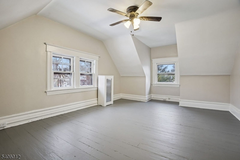 99 Lincoln Street Montclair, NJ 07042 - Photo 28 of 28 a view of an empty room with a window and wooden floor