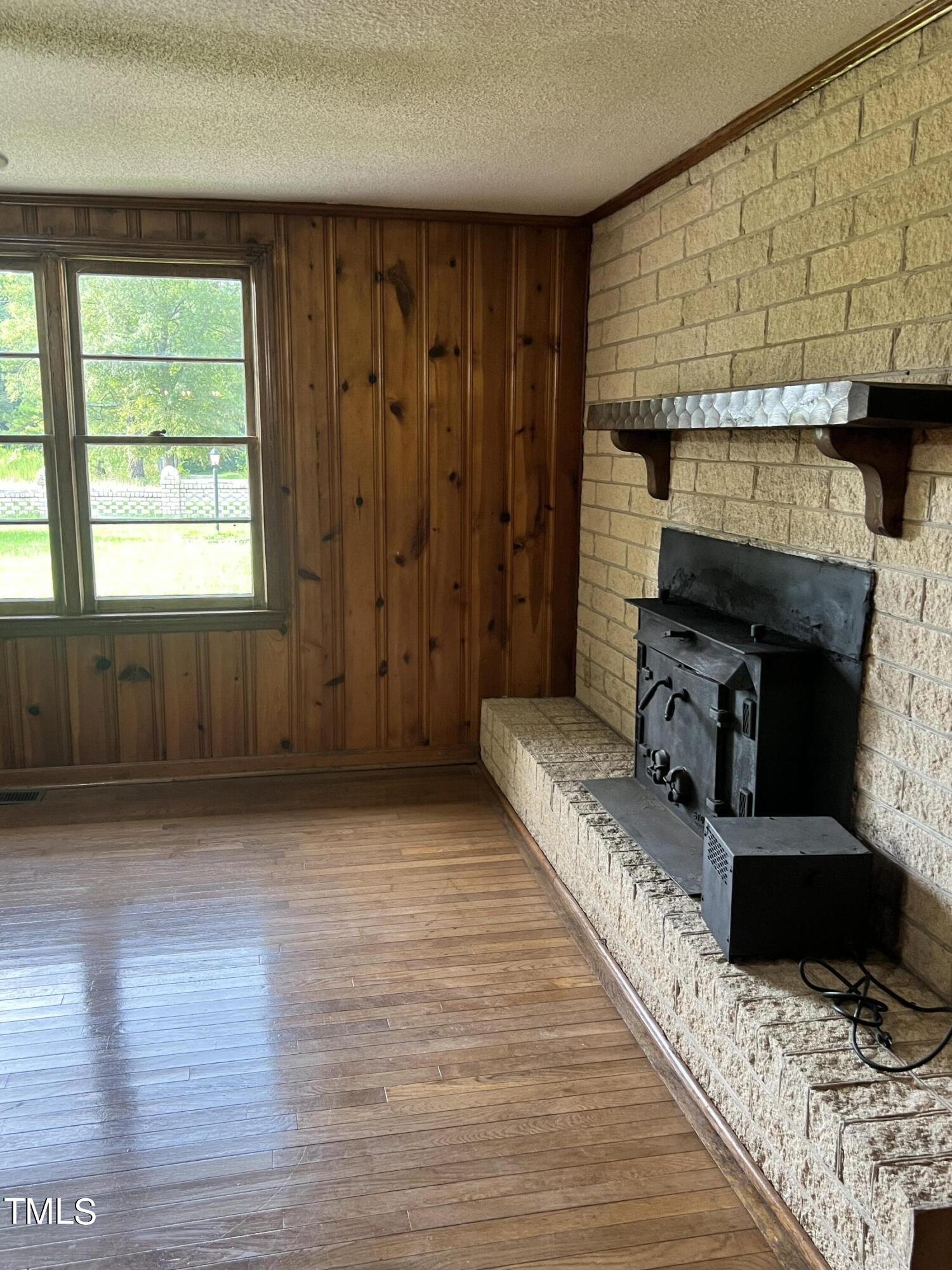 3226 Bunnlevel Erwin Road Erwin, NC 28339 - Photo 15 of 21 a living room with furniture and a fireplace