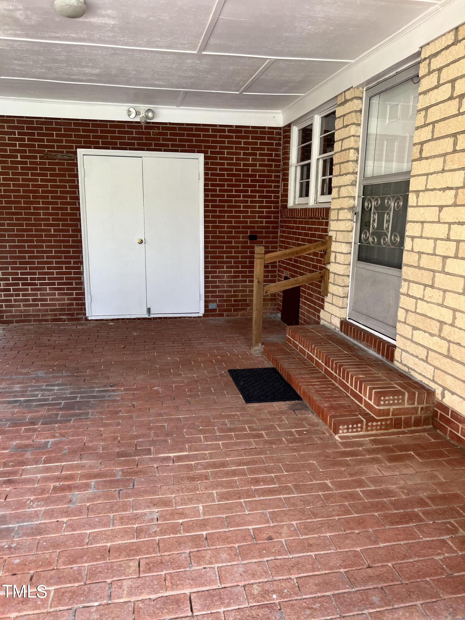 3226 Bunnlevel Erwin Road Erwin, NC 28339 - Photo 17 of 21 a view of a livingroom with a fireplace and a window