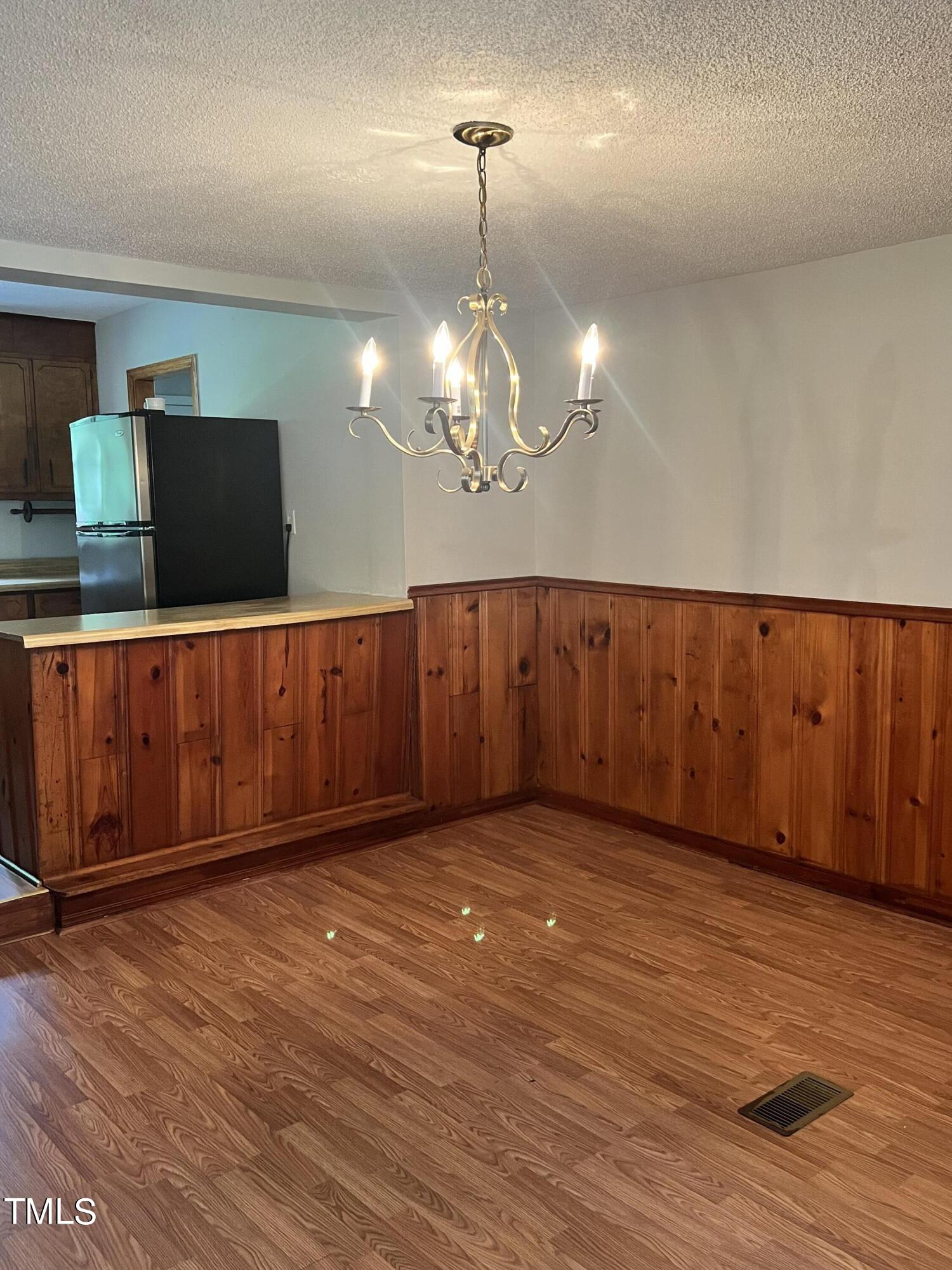3226 Bunnlevel Erwin Road Erwin, NC 28339 - Photo 4 of 21 a view of a room with wooden floor and chandelier