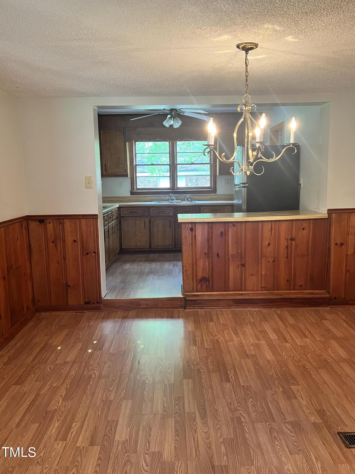 3226 Bunnlevel Erwin Road Erwin, NC 28339 - Photo 5 of 21 a view of a room with wooden floor and window